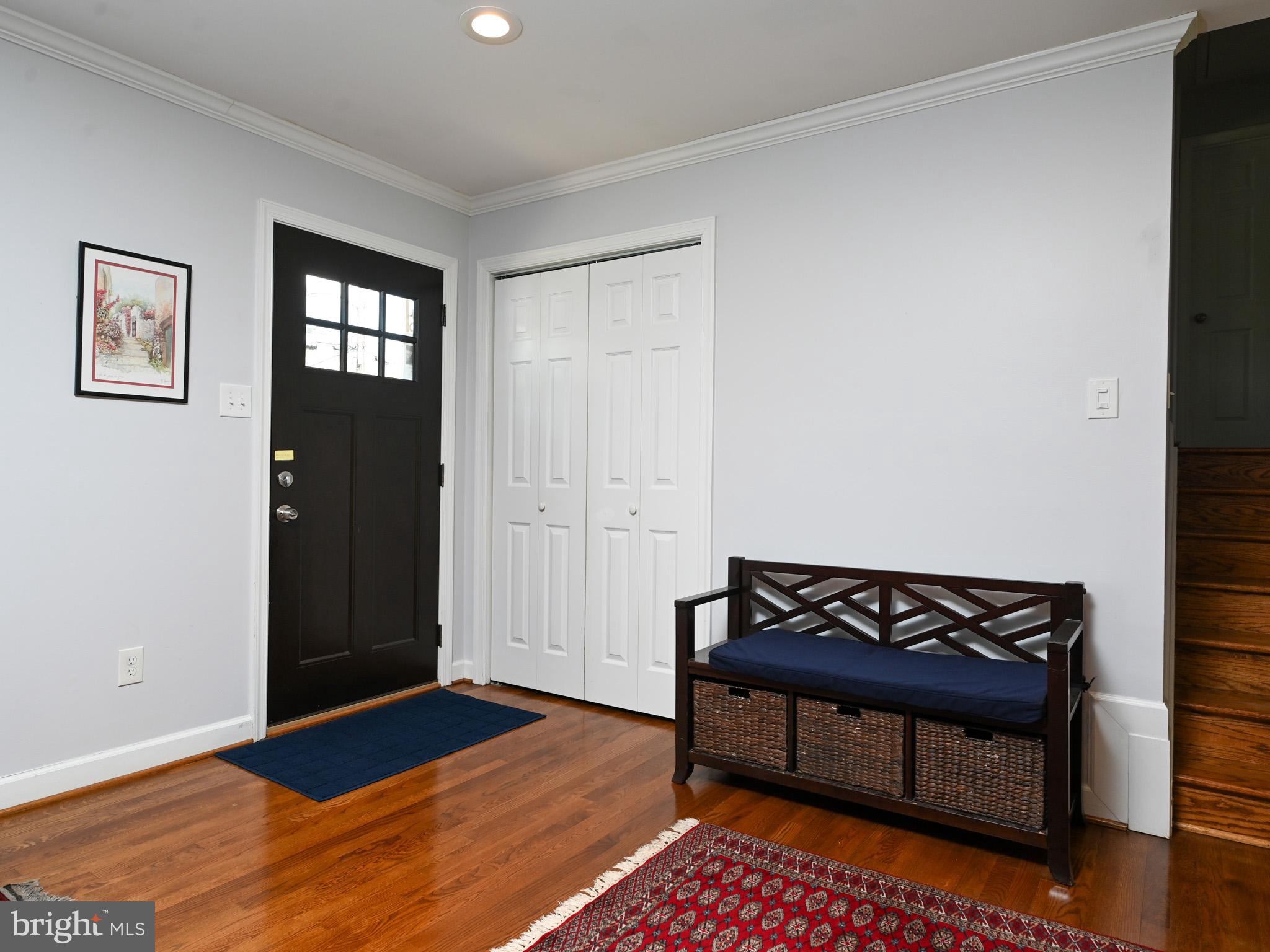 7951 Jansen Drive Springfield, VA 22152 - Photo 3 of 36 a view of a room with wooden floor and a cabinet