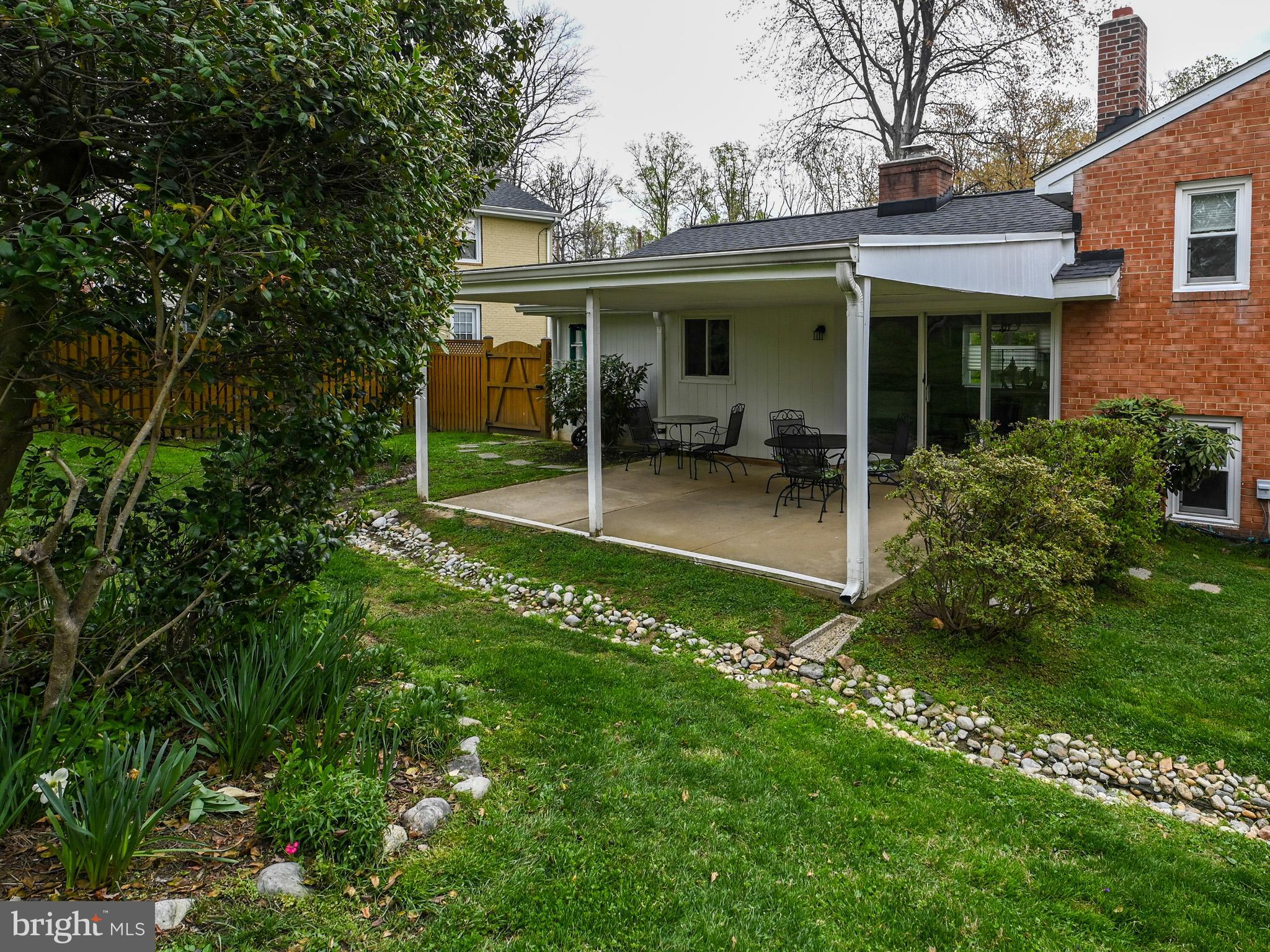 7951 Jansen Drive Springfield, VA 22152 - Photo 31 of 36 a view of a house with a yard porch and sitting area