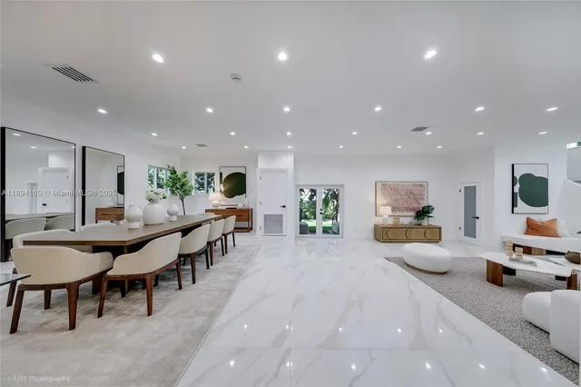 a kitchen with lots of counter top space and furniture