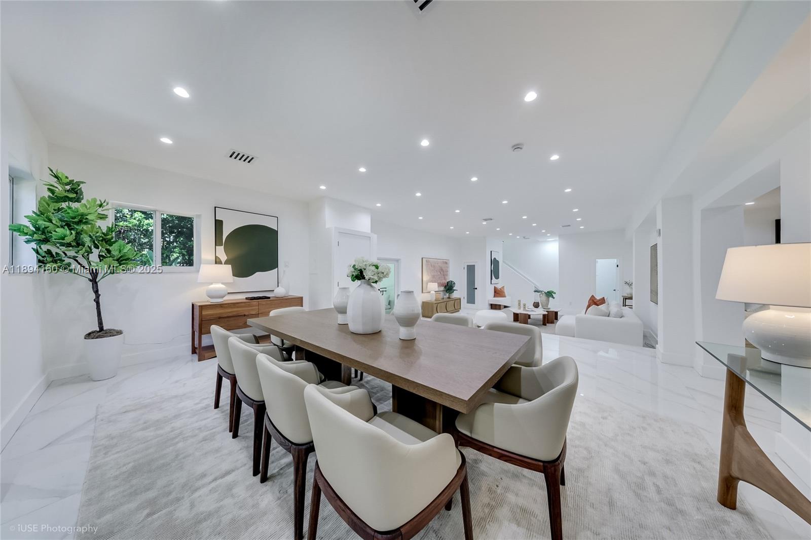 871 Northeast 81st Street Miami, FL 33138 - Photo 12 of 42 a living room with furniture and potted plants