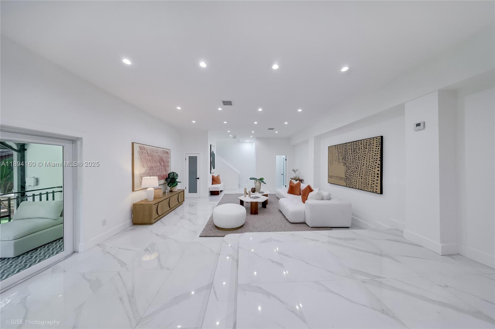 871 Northeast 81st Street Miami, FL 33138 - Photo 13 of 42 a large room with a bed