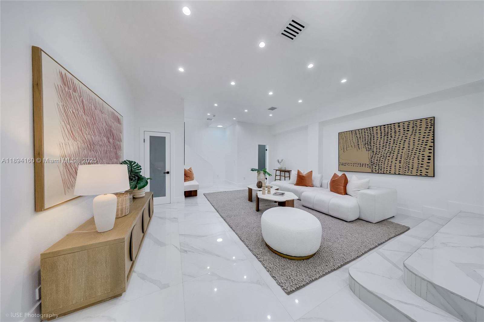 871 Northeast 81st Street Miami, FL 33138 - Photo 15 of 42 a living room with furniture and a couch