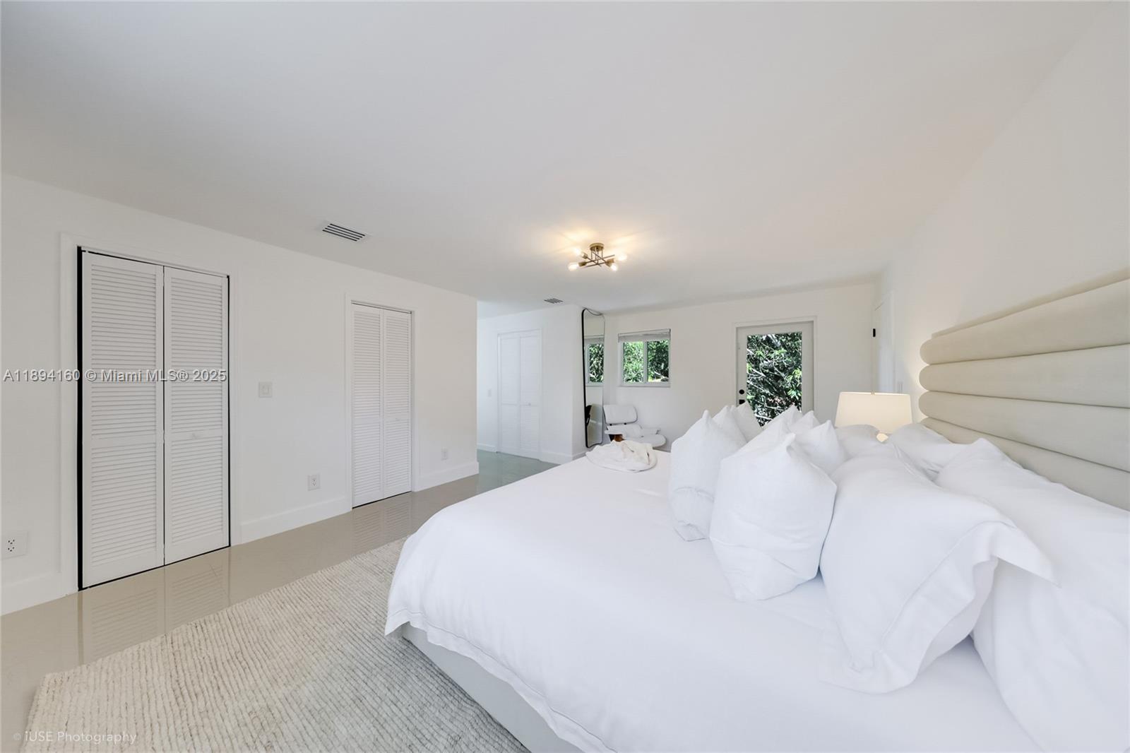 871 Northeast 81st Street Miami, FL 33138 - Photo 19 of 42 a large white bed in a white room