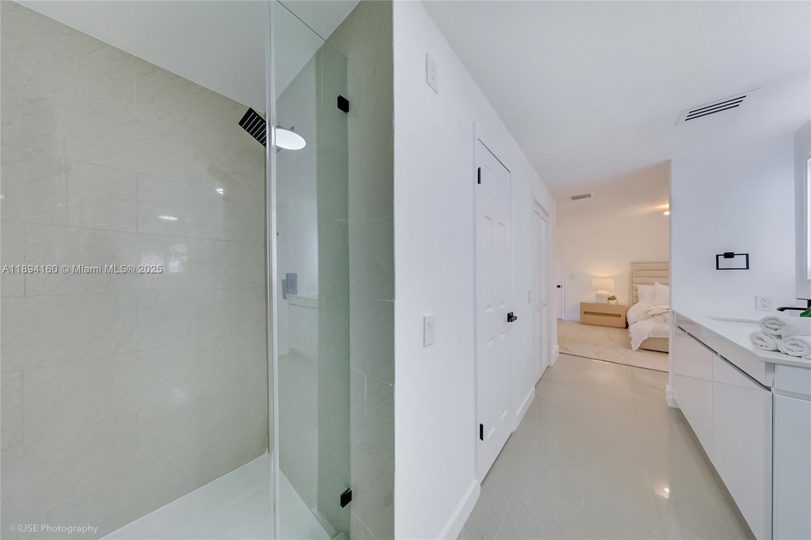 871 Northeast 81st Street Miami, FL 33138 - Photo 21 of 42 a bathroom with a double vanity sink toilet and shower