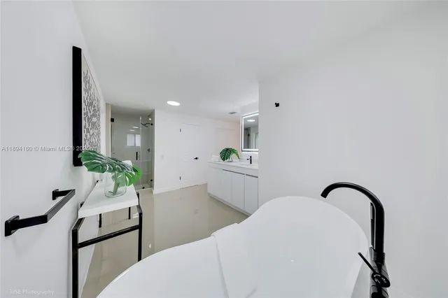 a workspace with a table chair and entryway