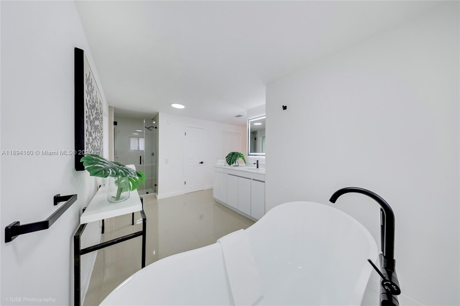 871 Northeast 81st Street Miami, FL 33138 - Photo 22 of 42 a workspace with a table chair and entryway