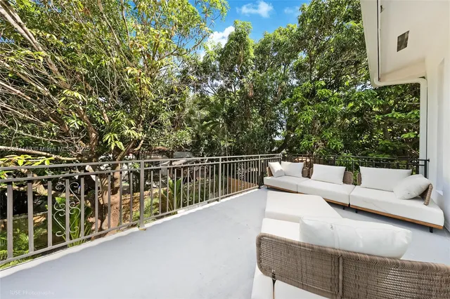 a view of balcony with furniture