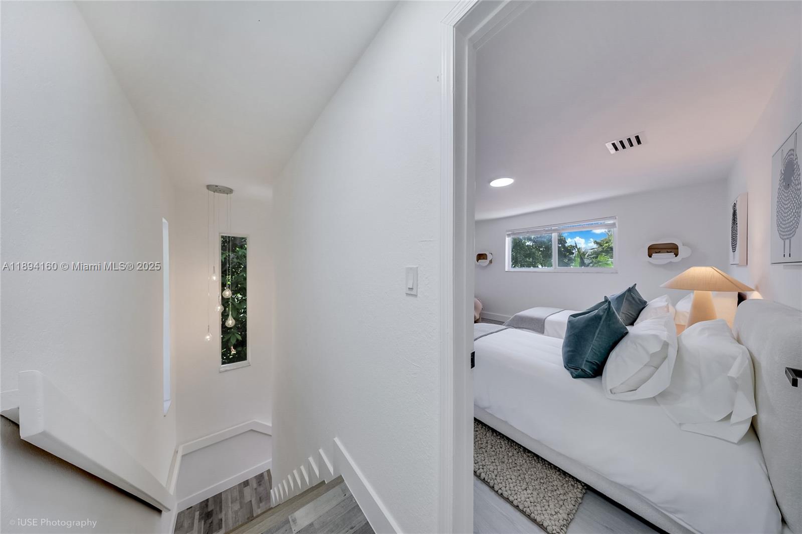 871 Northeast 81st Street Miami, FL 33138 - Photo 24 of 42 a bedroom with a bed and a window