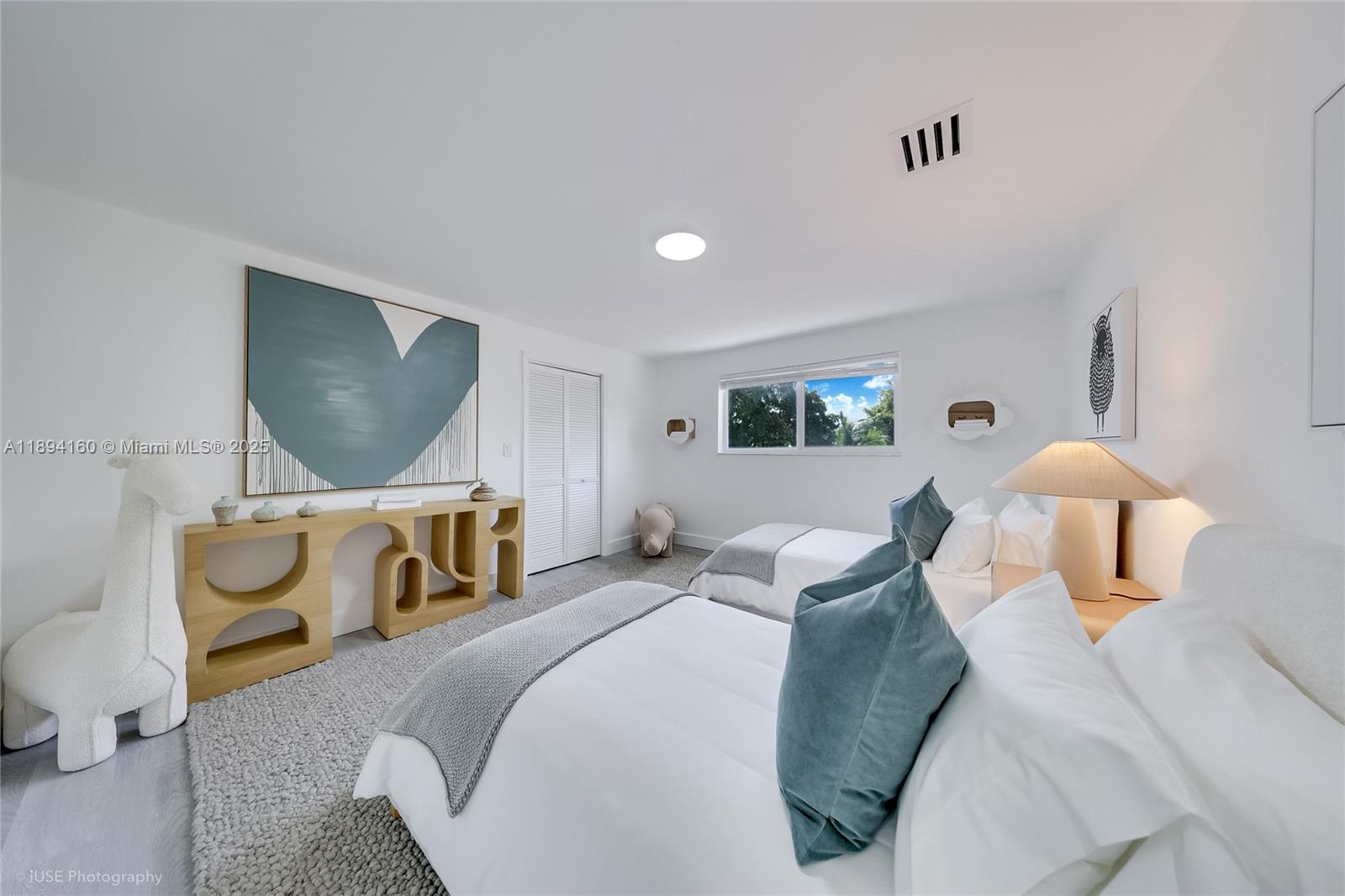 871 Northeast 81st Street Miami, FL 33138 - Photo 26 of 42 a bedroom with a bed and window