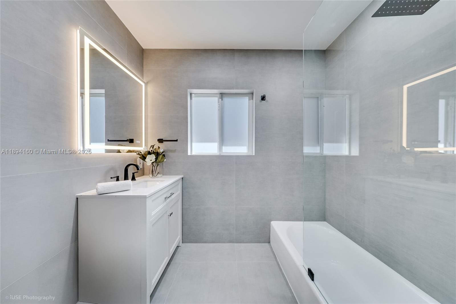 871 Northeast 81st Street Miami, FL 33138 - Photo 30 of 42 a bathroom with a sink a toilet and mirror