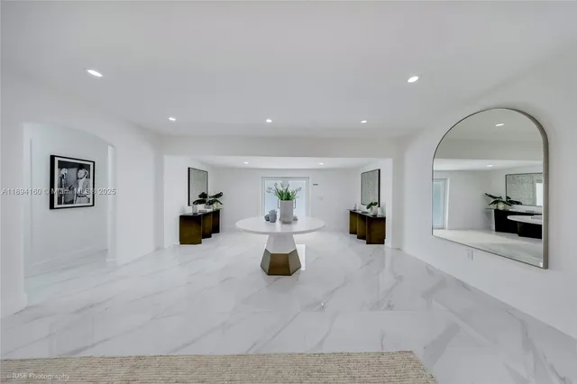 a view of living room filled with furniture and window