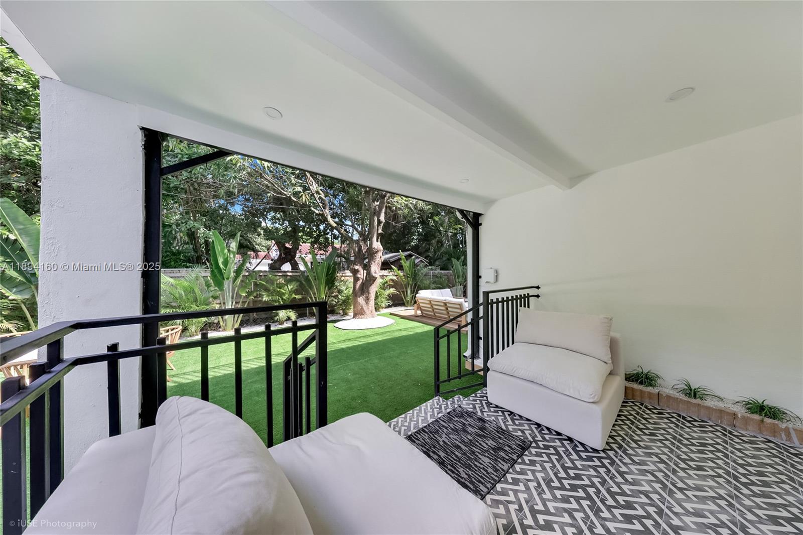 871 Northeast 81st Street Miami, FL 33138 - Photo 31 of 42 a view of a porch with furniture and garden