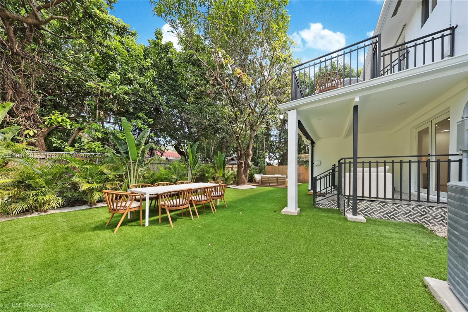 871 Northeast 81st Street Miami, FL 33138 - Photo 32 of 42 a view of a house with backyard porch and sitting area