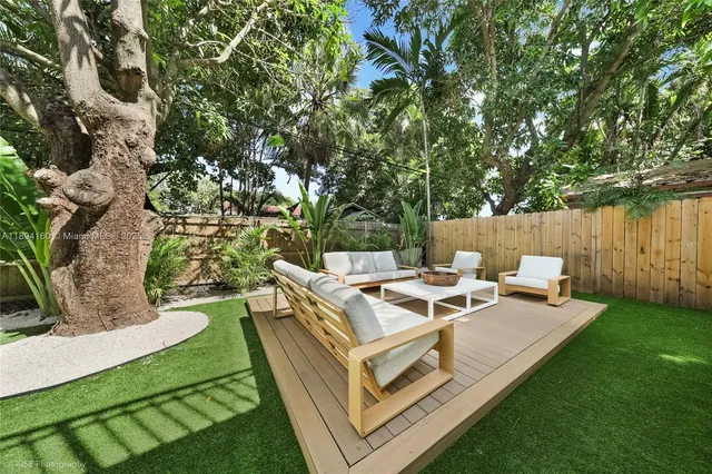 a view of a house with backyard porch and patio