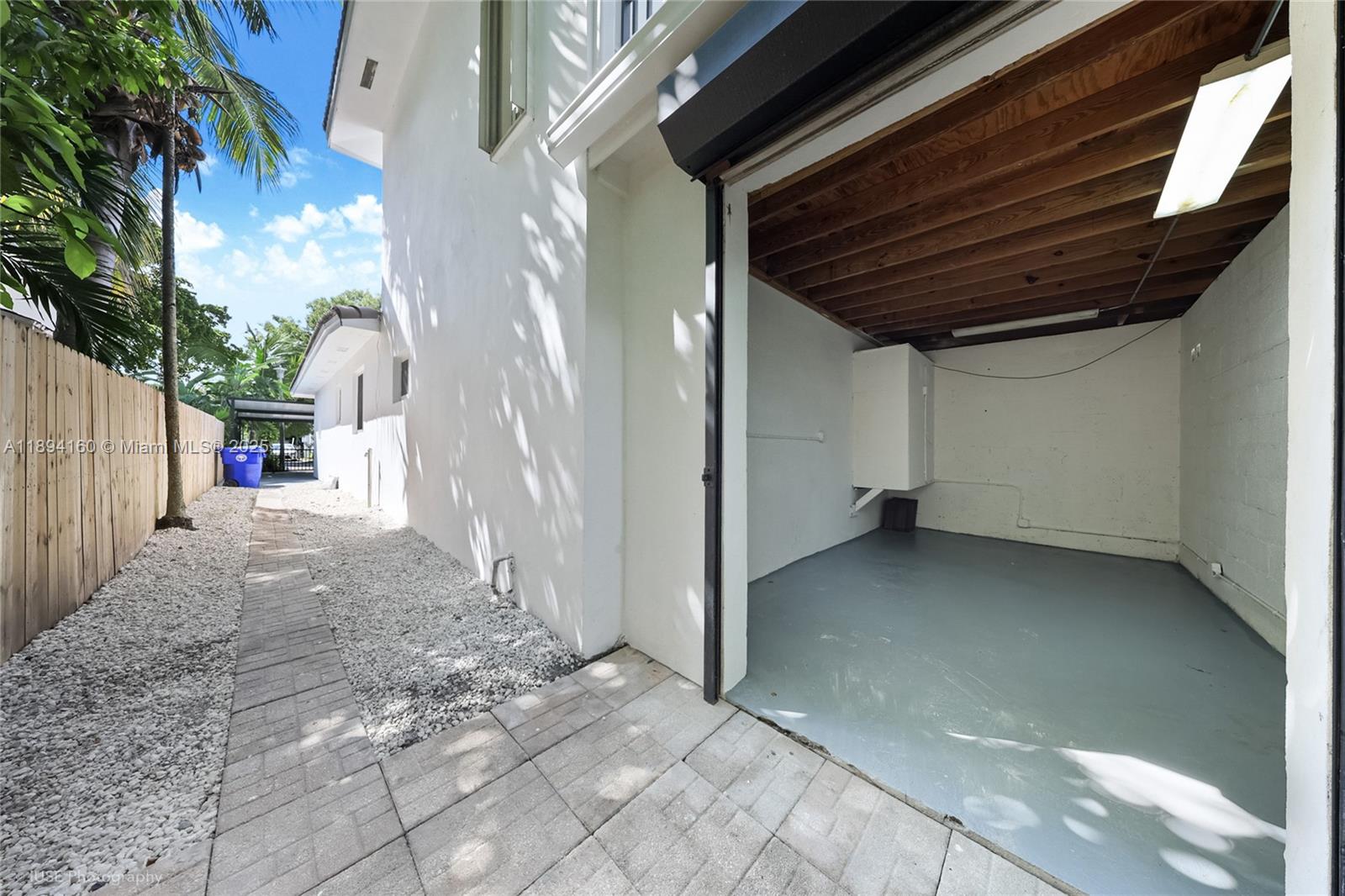 871 Northeast 81st Street Miami, FL 33138 - Photo 40 of 42 a view of a house with a backyard