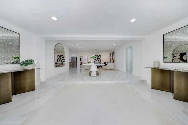 a lobby with furniture and window