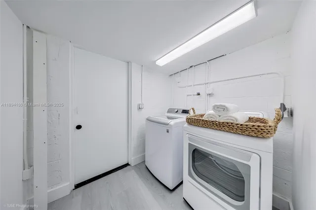 a utility room with dryer and washer