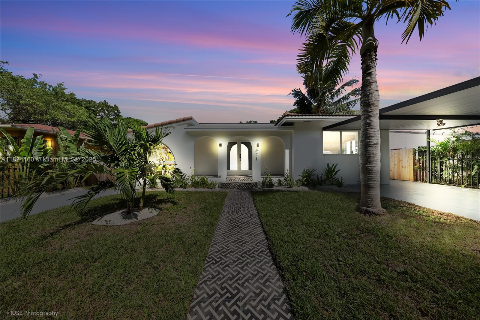 871 Northeast 81st Street Miami, FL 33138 - Photo 42 of 42 a front view of a house with a yard and potted plants