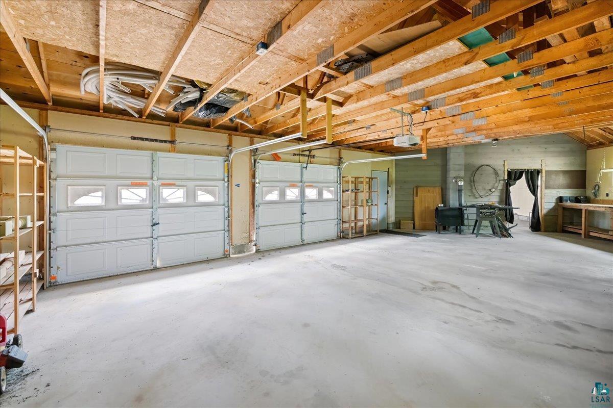 1804 North Bay Road Ely, MN 55731 - Photo 36 of 37 Garage featuring a garage door opener