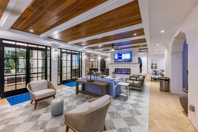 a living room with furniture fireplace and a flat screen tv