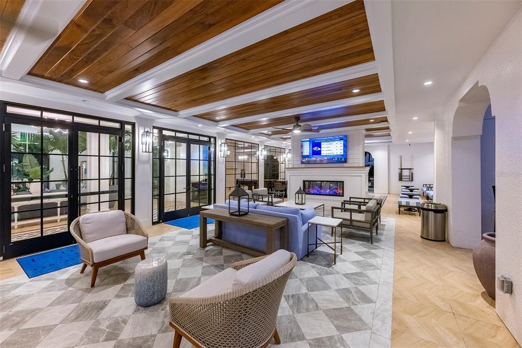 10535 Hamilton Dawn Street, Unit 9302 Orlando, FL 32821 - Photo 18 of 20 a living room with furniture large window and flat screen tv