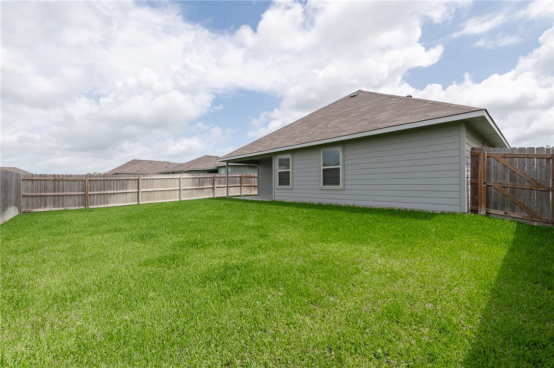 2166 Chief Street Bryan, TX 77807 - Photo 17 of 18 a view of a backyard with a garden
