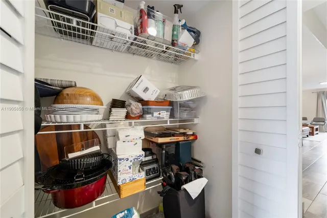 a kitchen with a sink and white stainless steel appliances