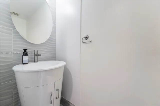 a large kitchen with a table and chairs