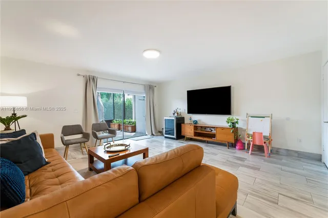 a bedroom with furniture and a wooden floor