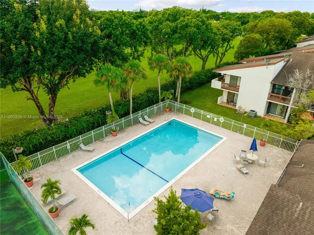 a view of outdoor space with seating area and green space