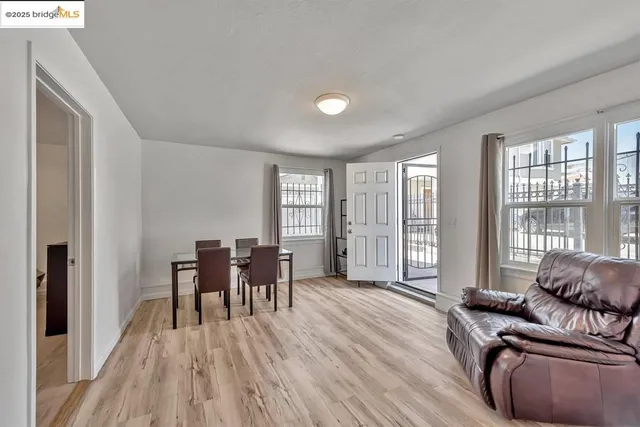 a living room with furniture and large windows