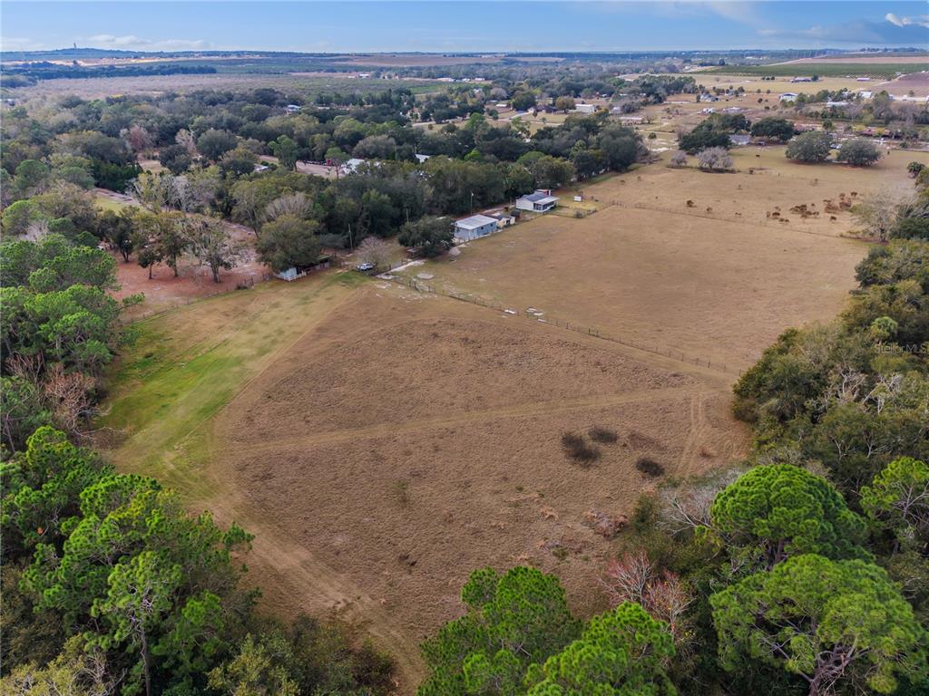 an aerial view of a beach with a yard