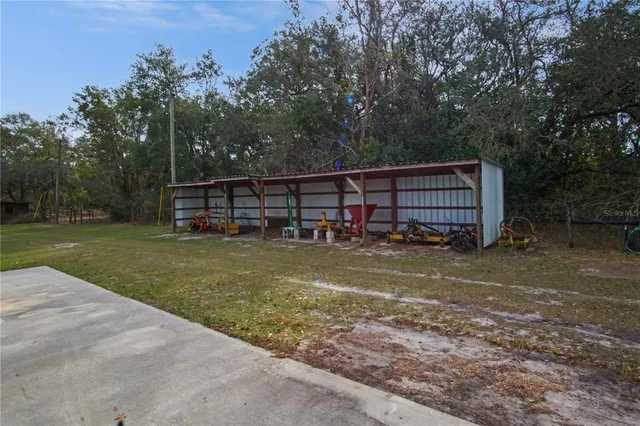 a view of a wooden deck with a big yard
