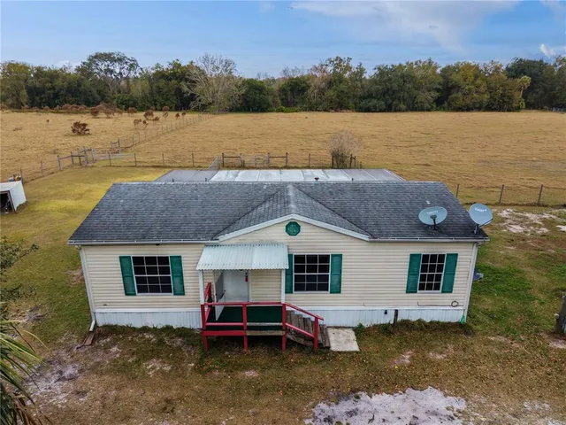 a aerial view of a house with a lake view