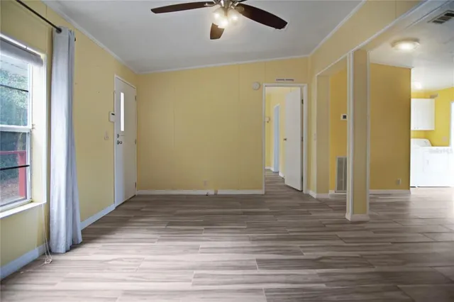 a view of a livingroom with wooden floor