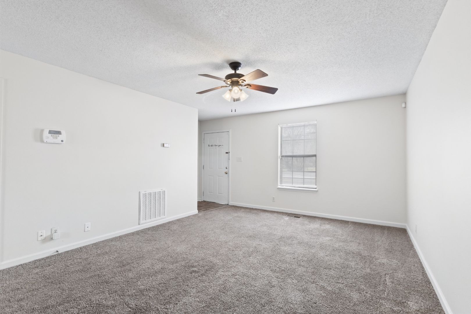 725 Peachers Mill Road Clarksville, TN 37042 - Photo 3 of 15 an empty room with fan and windows