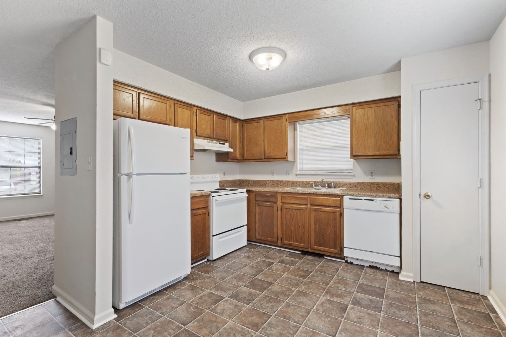725 Peachers Mill Road Clarksville, TN 37042 - Photo 6 of 15 a kitchen with a refrigerator sink stove and cabinets