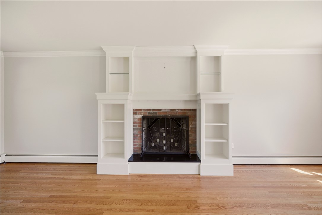 5 Heritage Road Bristol, RI 02809 - Photo 9 of 50 Custom Built-ins Surrounding Living Room Fireplace