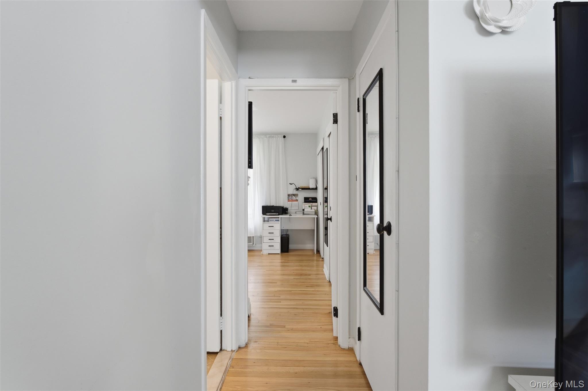 25 Trinity Place, Unit 2K New Rochelle, NY 10805 - Photo 11 of 25 Hallway leading to bathroom and bedroom.
