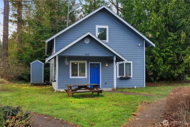 a front view of house with yard and green space