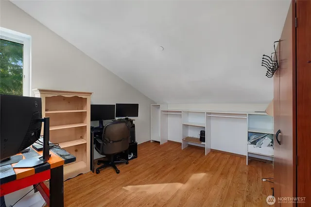 a workspace with furniture hardwood and a window