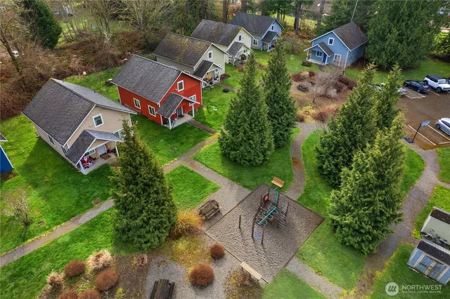 an aerial view of house with yard swimming pool and outdoor seating