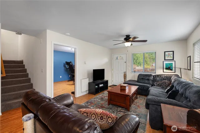 a living room with furniture and a flat screen tv