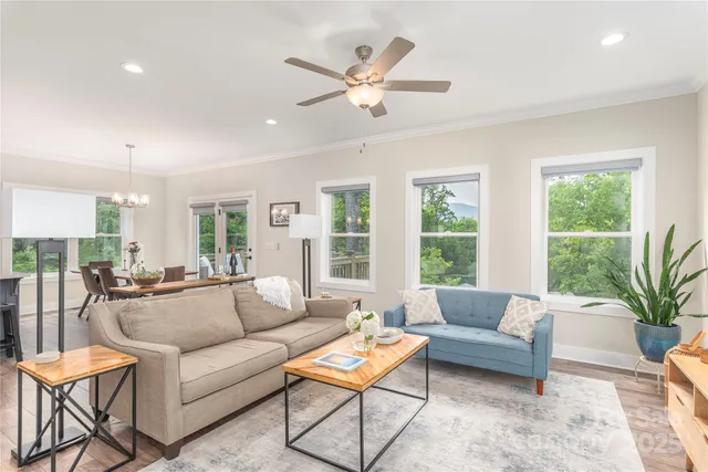a living room with furniture and a large window