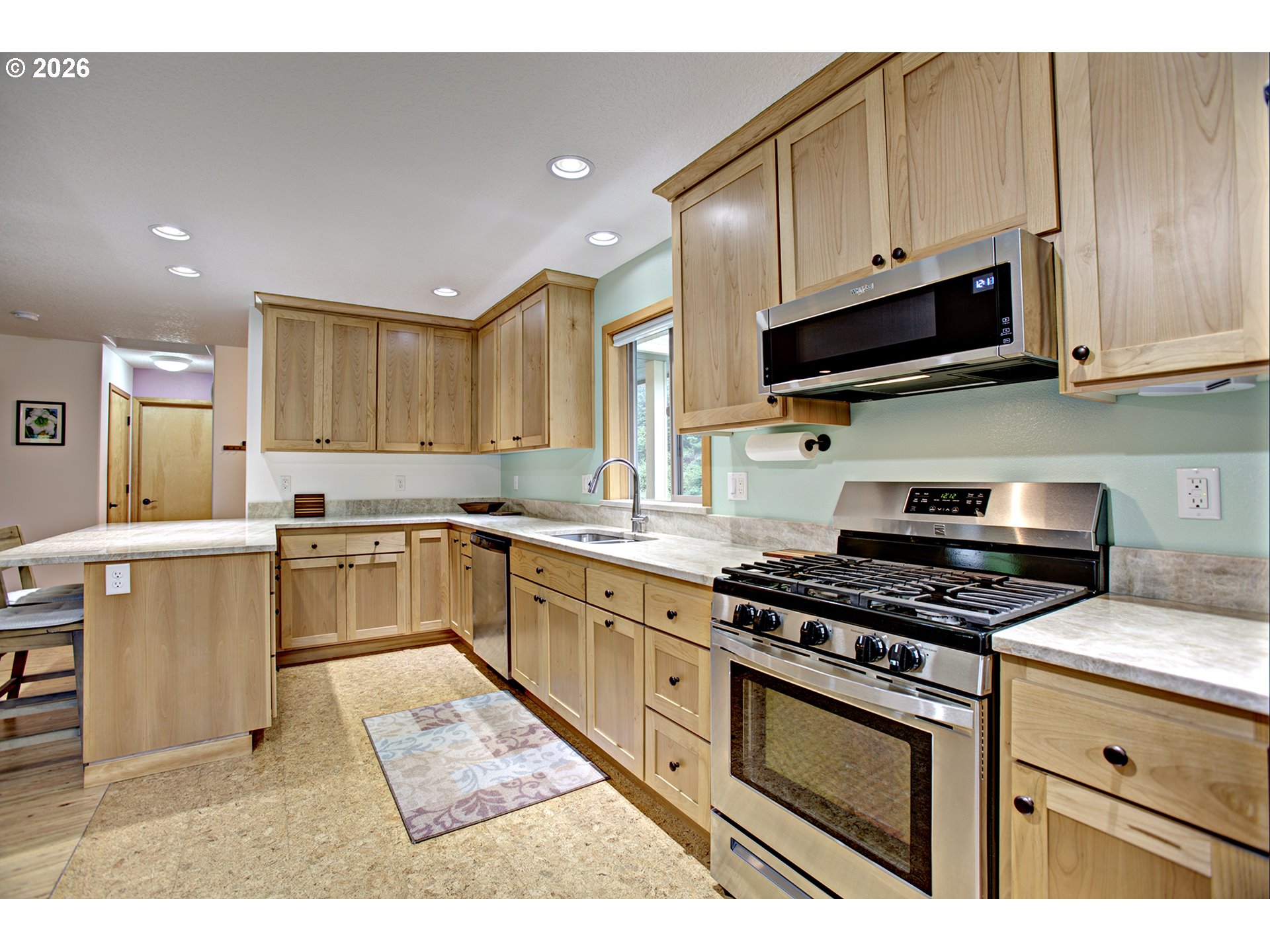 60300 Rays Way St. Helens, OR 97051 - Photo 10 of 41 a kitchen with granite countertop a stove top oven sink and cabinets
