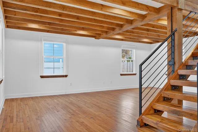 a view of an entryway with wooden floor