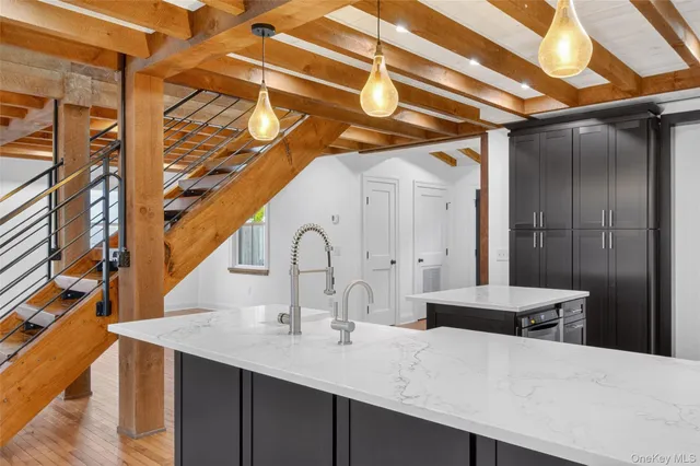 a kitchen with a sink and cabinets
