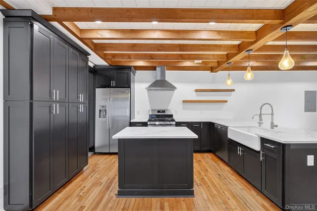 a kitchen with a sink and refrigerator