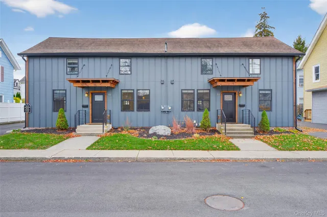 a front view of a house with garden