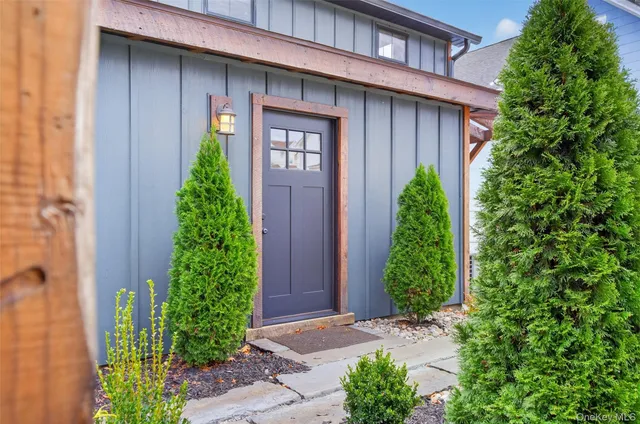 a couple of potted plants in front of door